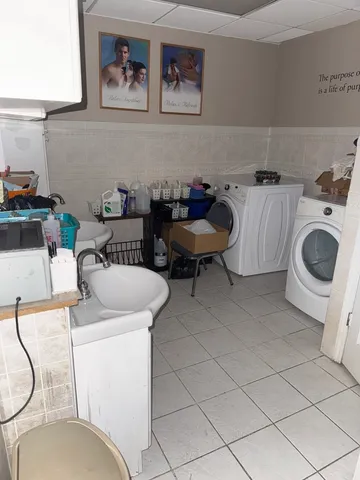 a view of kitchen with furniture and window