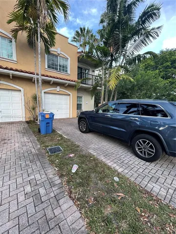 a view of a car parked in front of a house