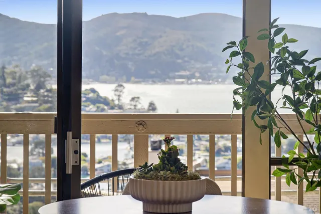 a view of a balcony with chairs