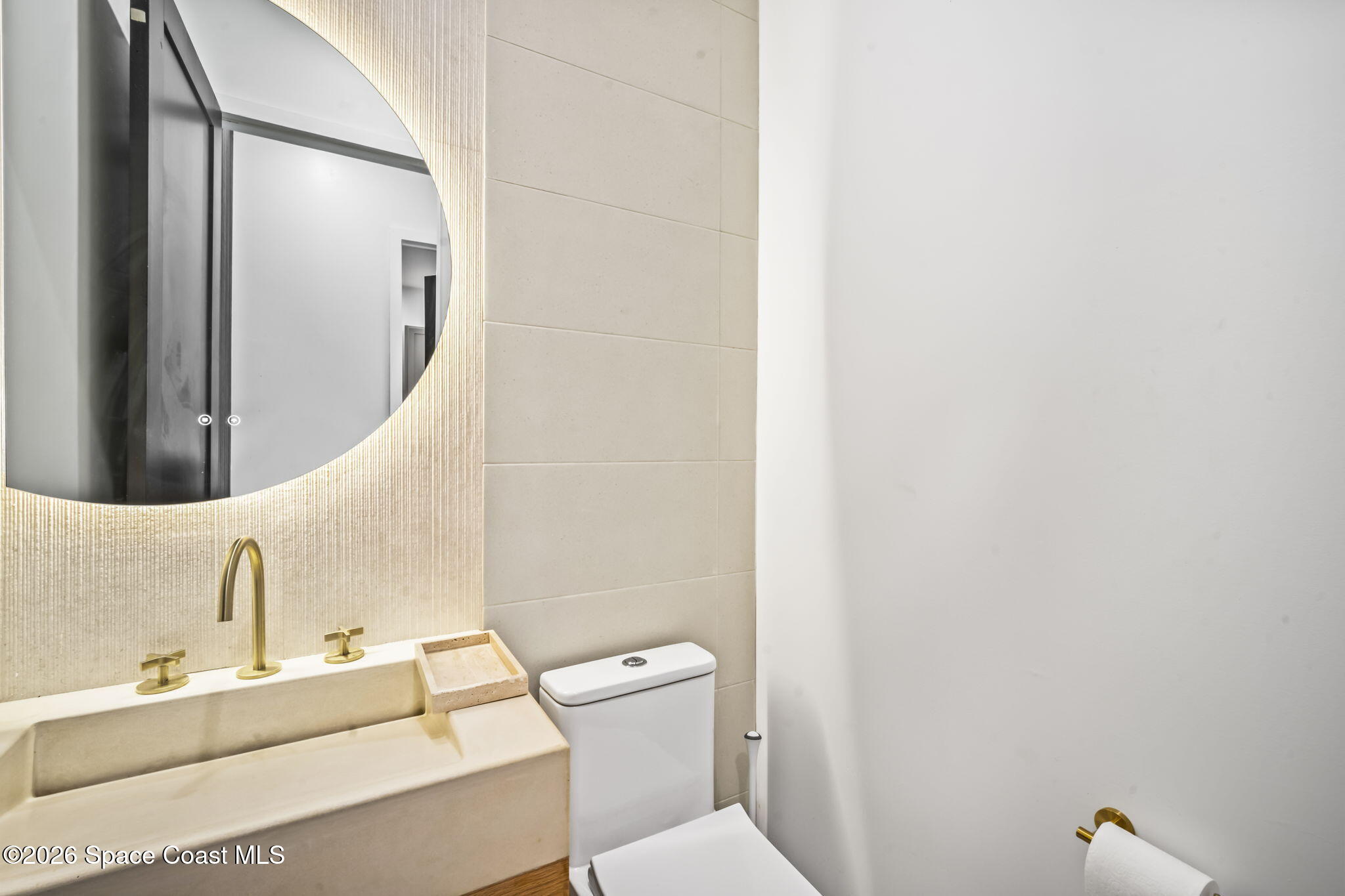 785 Seymour Road Northeast Palm Bay, FL 32905 - Photo 34 of 67 a bathroom with a sink a toilet and a mirror