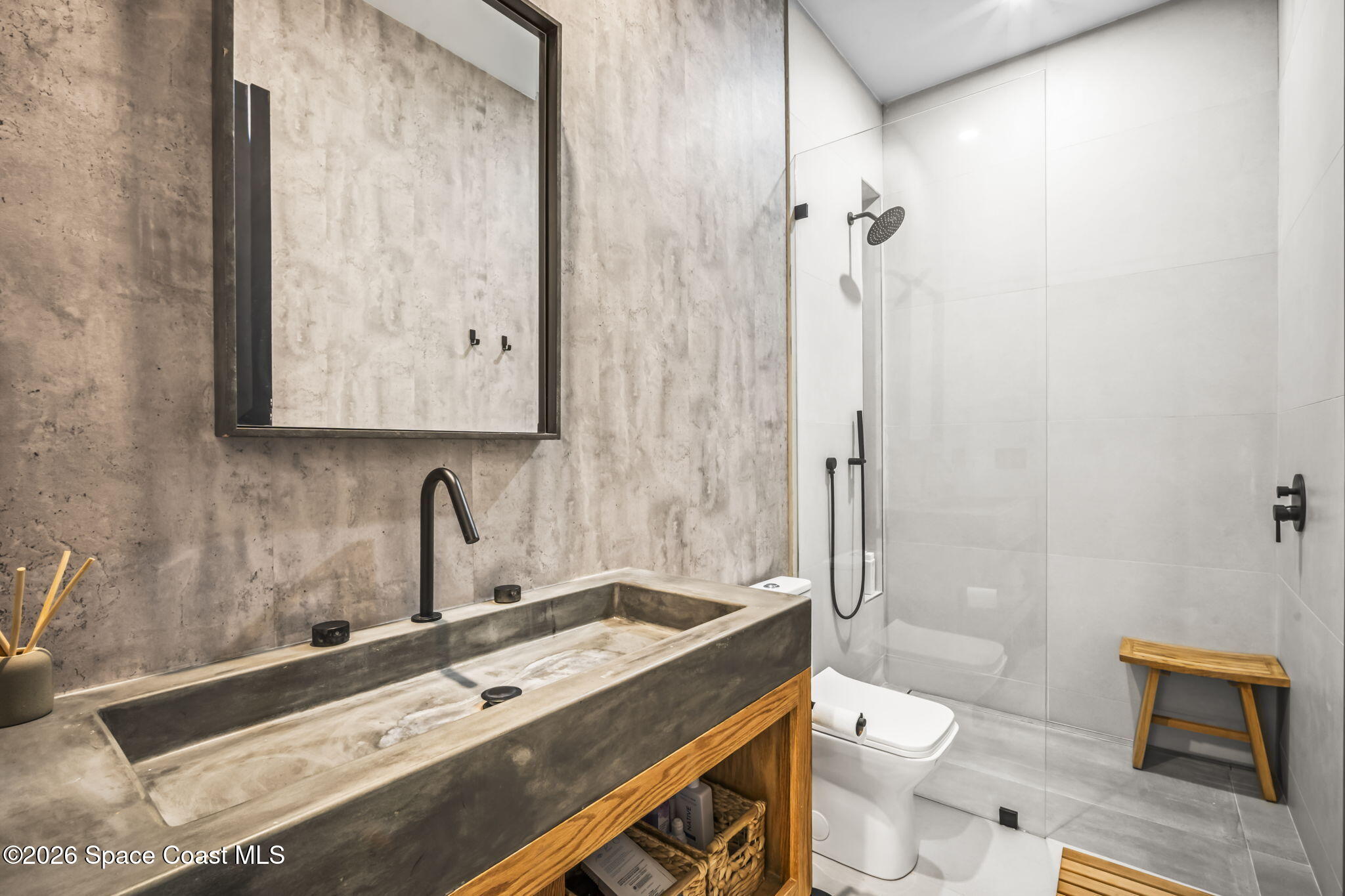 785 Seymour Road Northeast Palm Bay, FL 32905 - Photo 40 of 67 a bathroom with a sink a toilet and shower