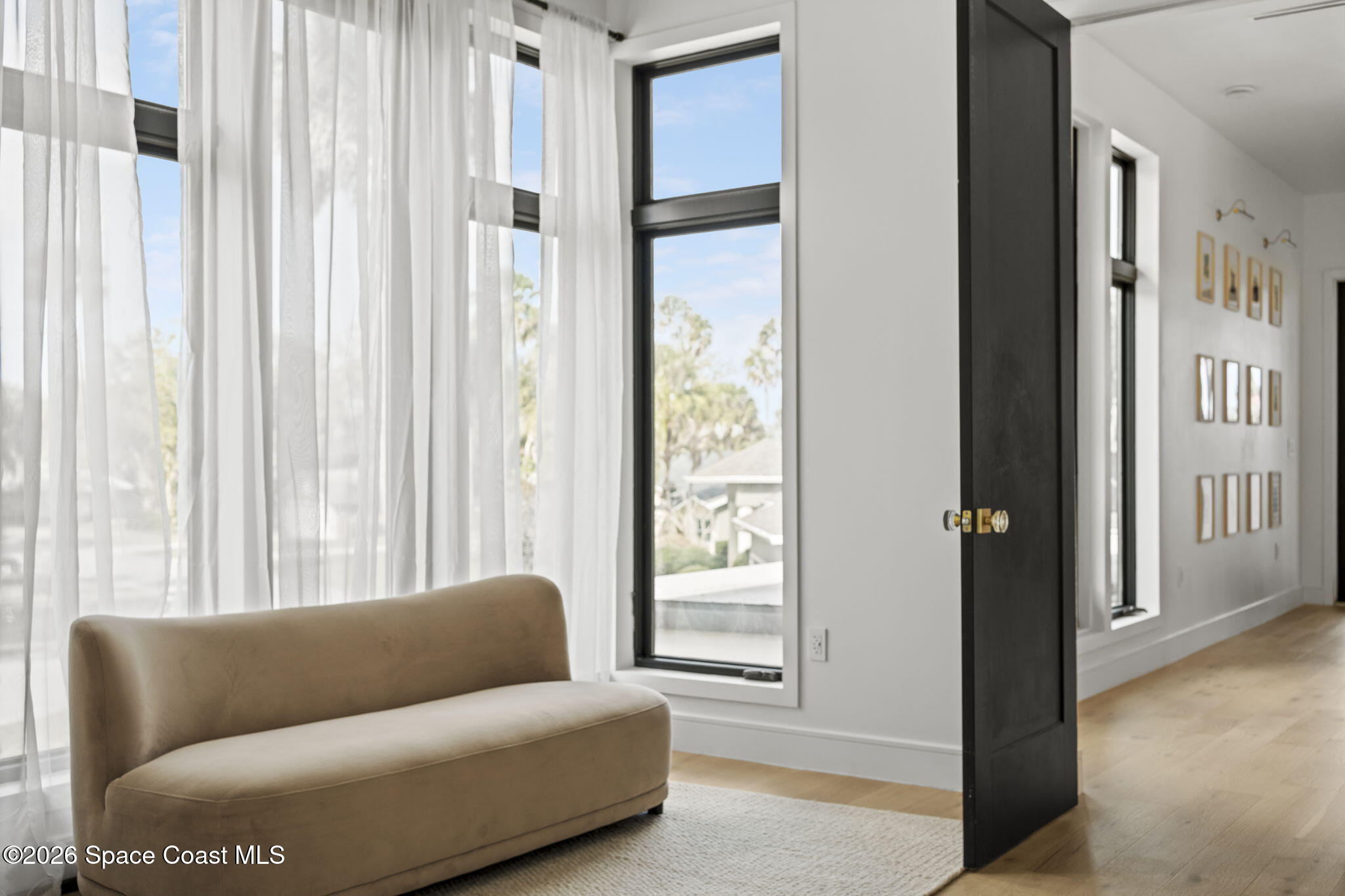 785 Seymour Road Northeast Palm Bay, FL 32905 - Photo 46 of 67 a living room with furniture and a large window