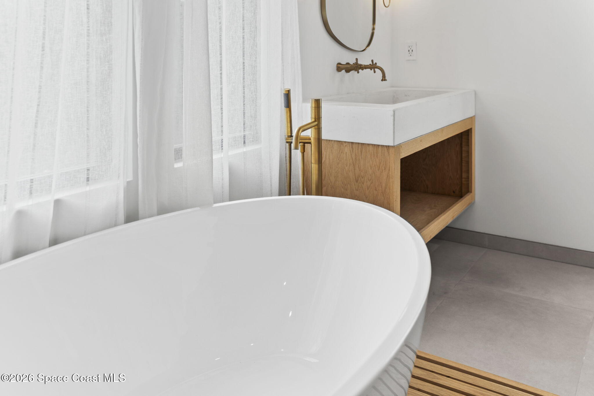 785 Seymour Road Northeast Palm Bay, FL 32905 - Photo 49 of 67 a bathroom with a sink and mirror