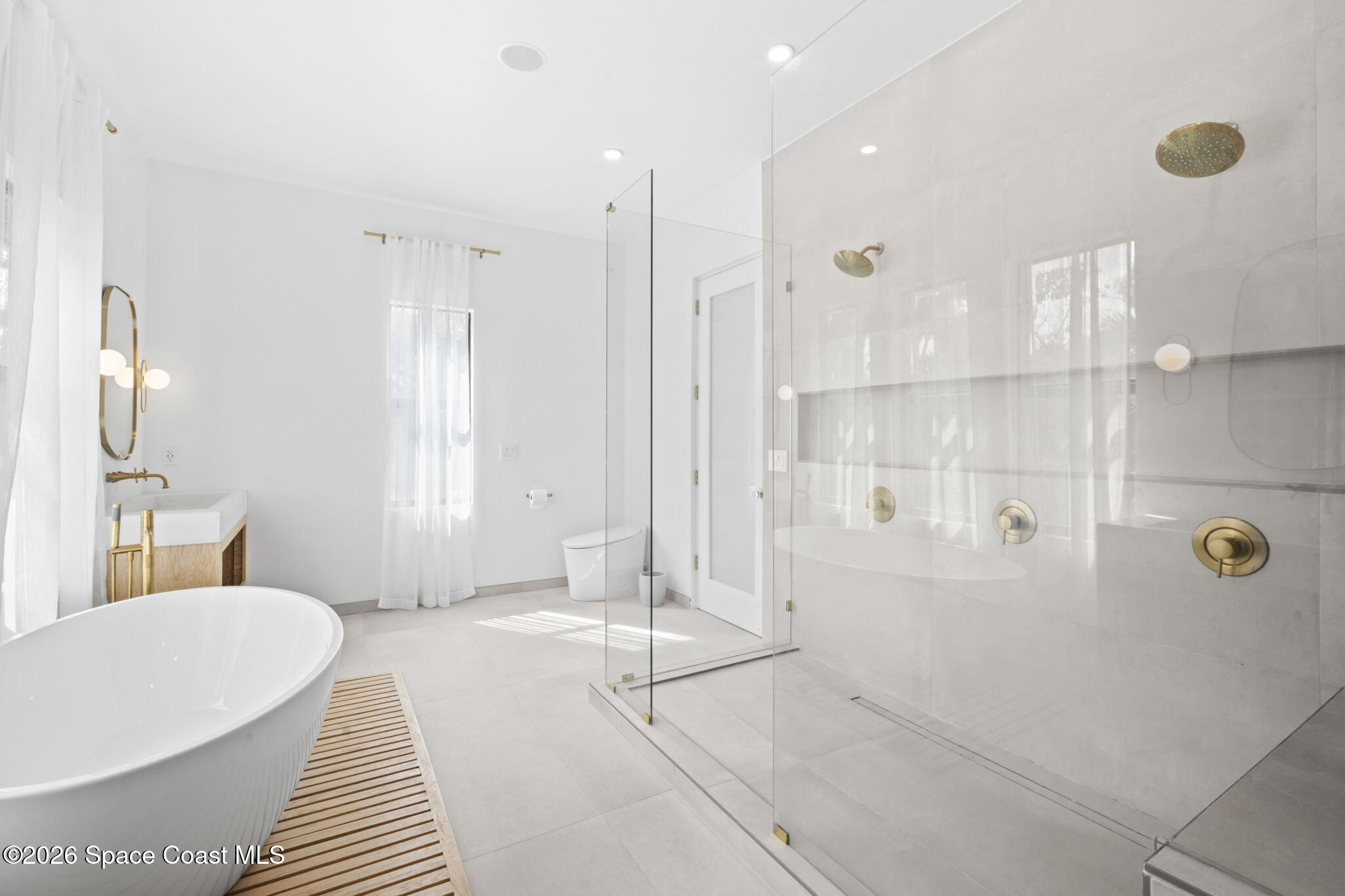 785 Seymour Road Northeast Palm Bay, FL 32905 - Photo 51 of 67 a spacious bathroom with a bathtub and shower