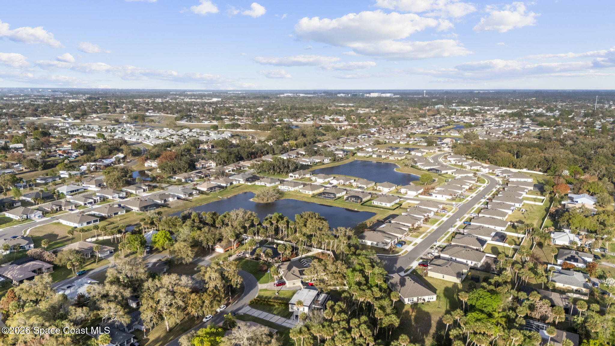785 Seymour Road Northeast Palm Bay, FL 32905 - Photo 65 of 67 an aerial view of residential building with green space