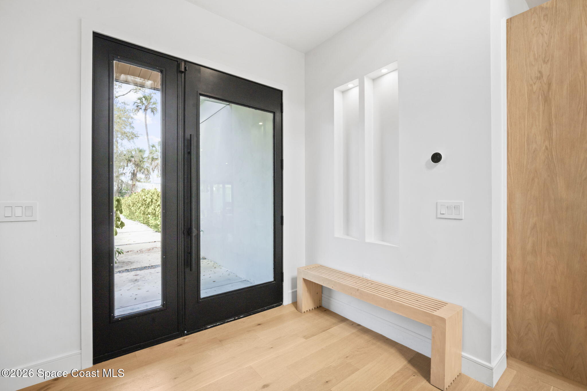 785 Seymour Road Northeast Palm Bay, FL 32905 - Photo 7 of 67 a bedroom with a bed and a window