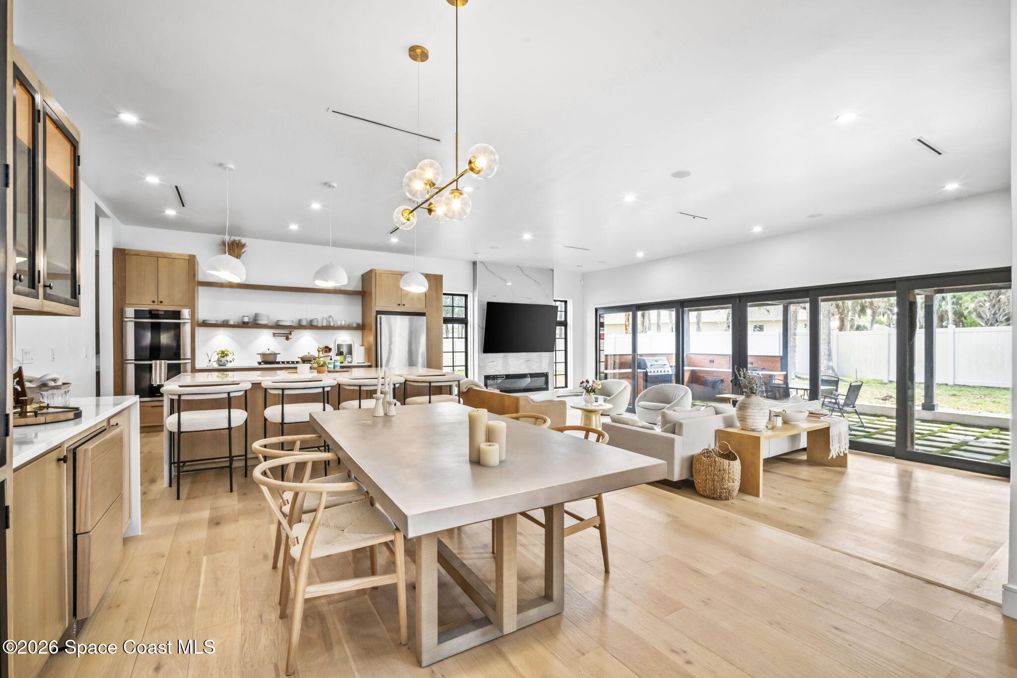 785 Seymour Road Northeast Palm Bay, FL 32905 - Photo 9 of 67 a living room with lots of furniture and a flat screen tv
