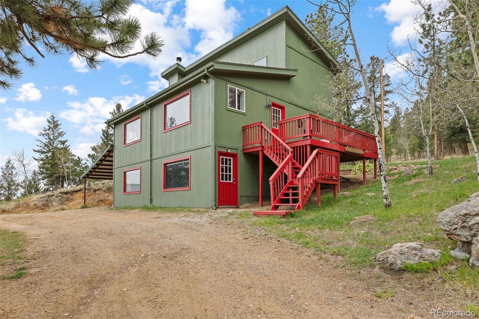 518 Pine Drive Bailey, CO 80421 - Photo 1 of 43 a view of a house with a yard