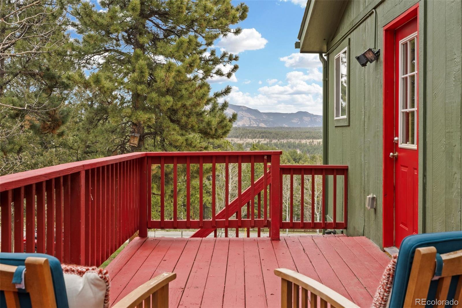 518 Pine Drive Bailey, CO 80421 - Photo 1 of 50 a view of balcony with wooden floor and fence