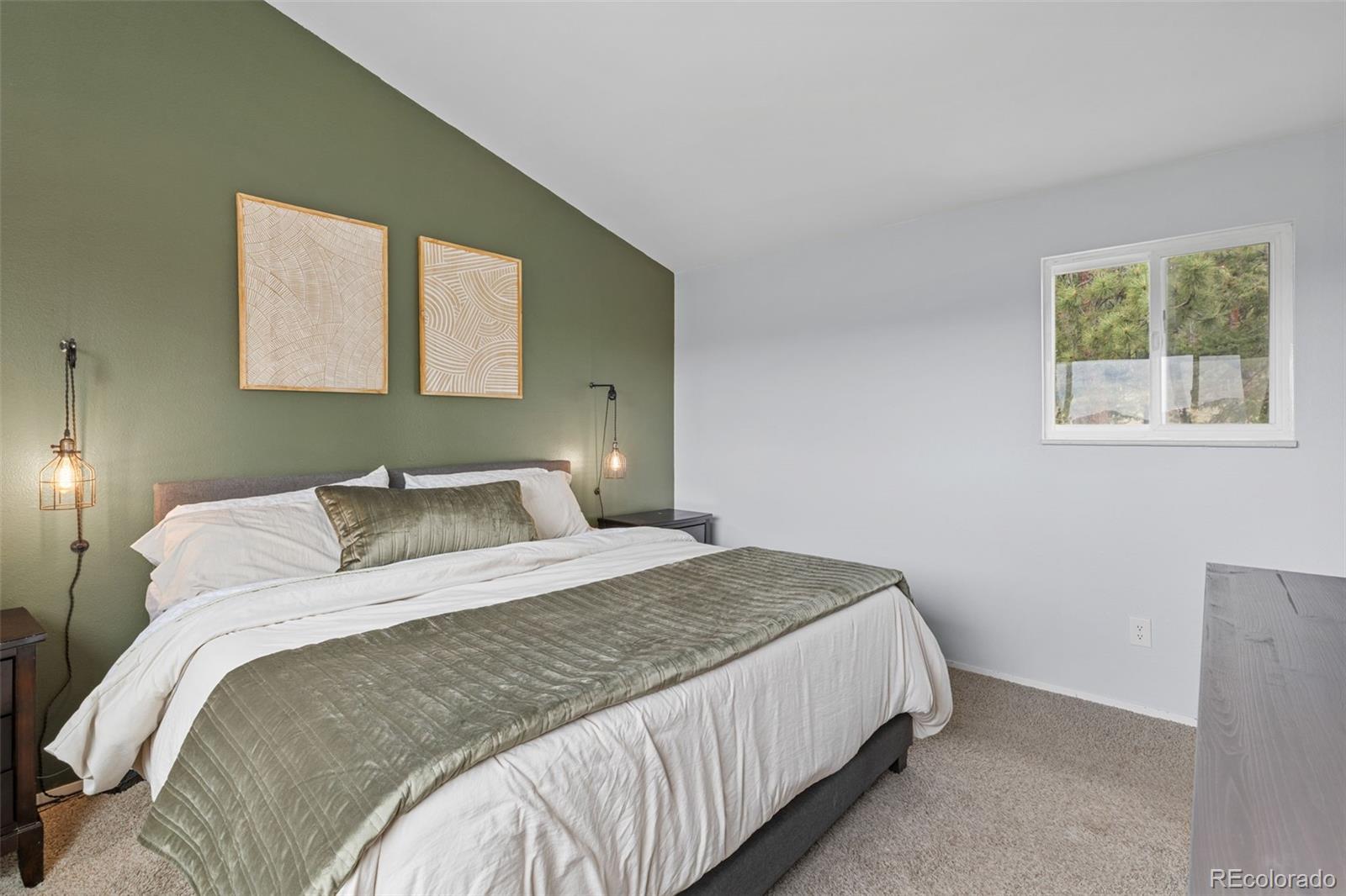 518 Pine Drive Bailey, CO 80421 - Photo 22 of 43 a bedroom with a bed and a window