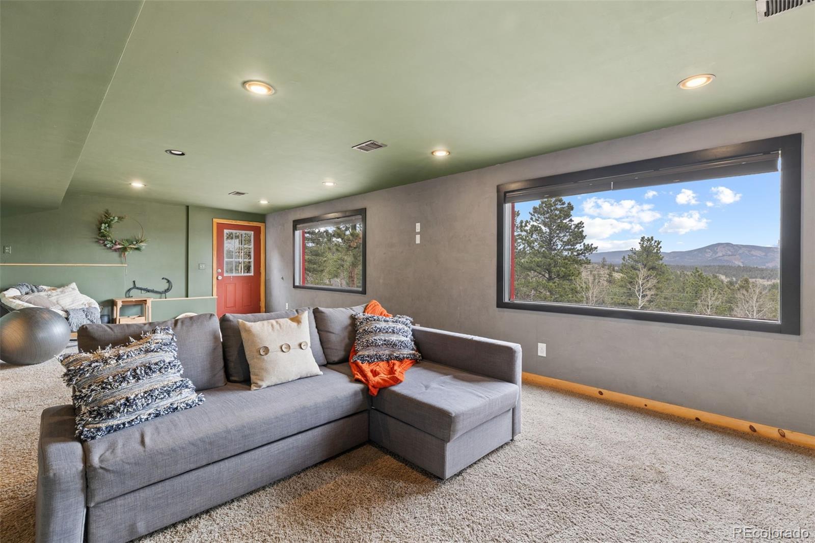 518 Pine Drive Bailey, CO 80421 - Photo 29 of 43 a living room with furniture and a large window