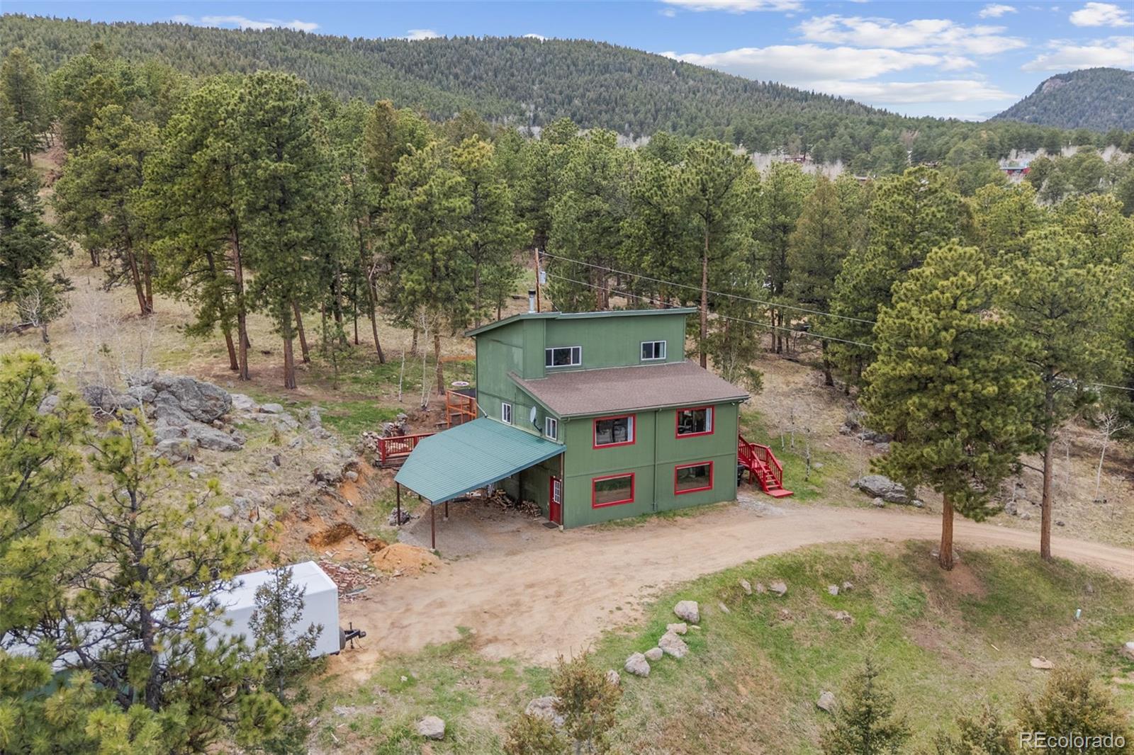 518 Pine Drive Bailey, CO 80421 - Photo 36 of 43 a view of a house with a yard