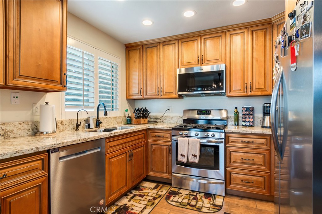 3198 Bexfield Court Riverside, CA 92503 - Photo 8 of 24 Kitchen with Custom Cabinets and Stainless Steel Appliances