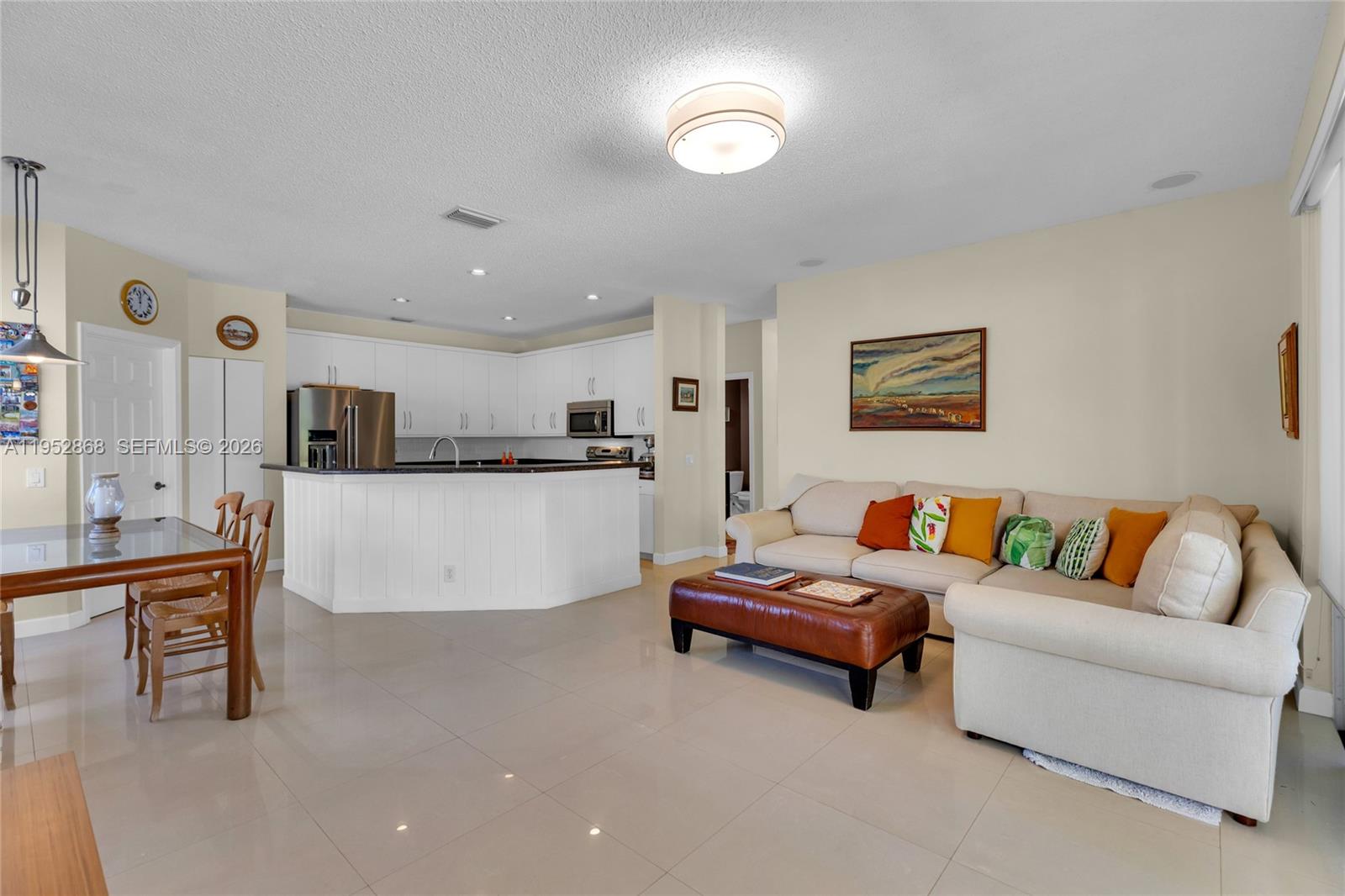 4441 Stone Ridge Way Weston, FL 33331 - Photo 21 of 87 a living room with furniture and a flat screen tv