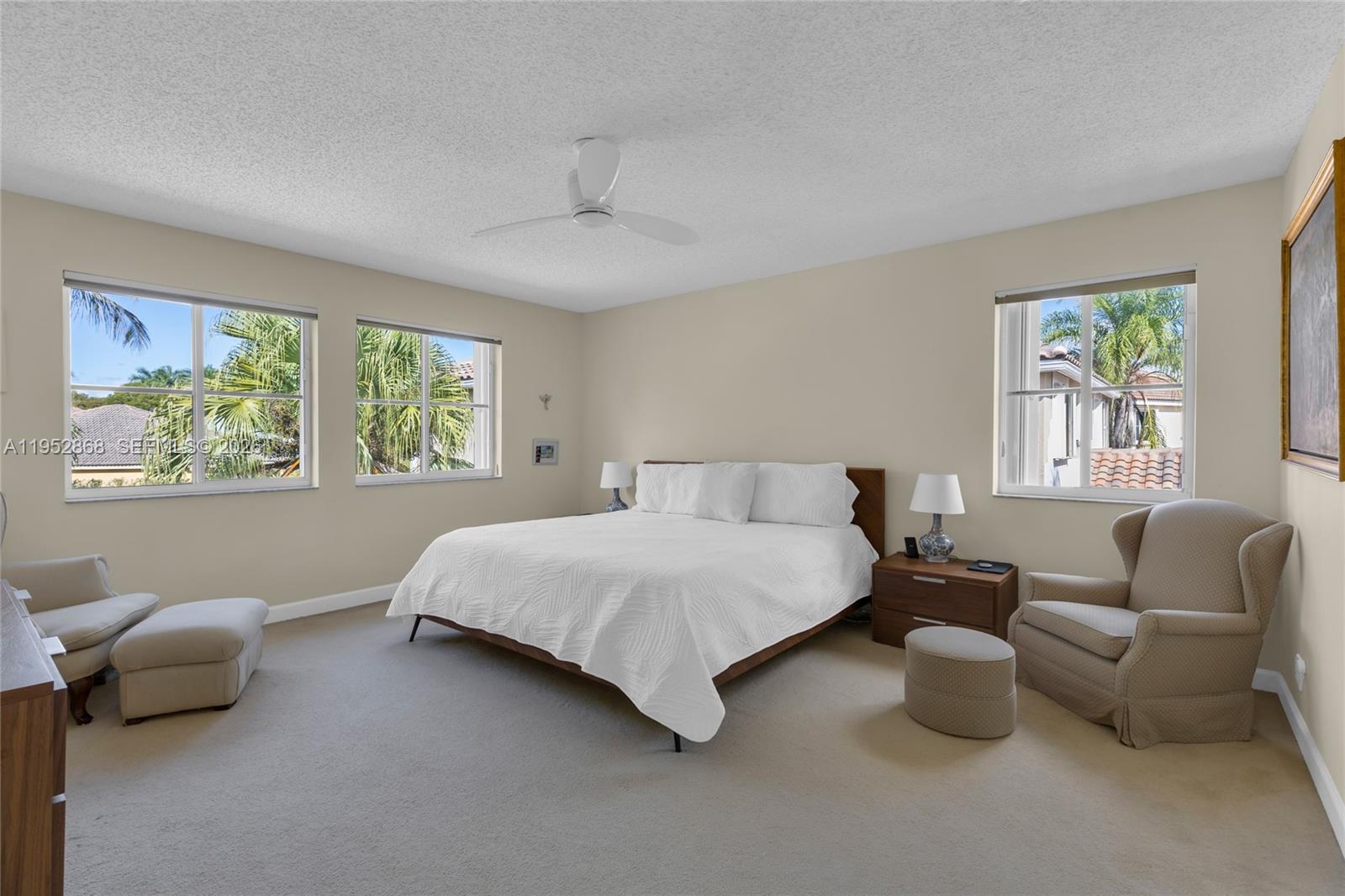 4441 Stone Ridge Way Weston, FL 33331 - Photo 37 of 87 a bedroom with a bed and a couch with window