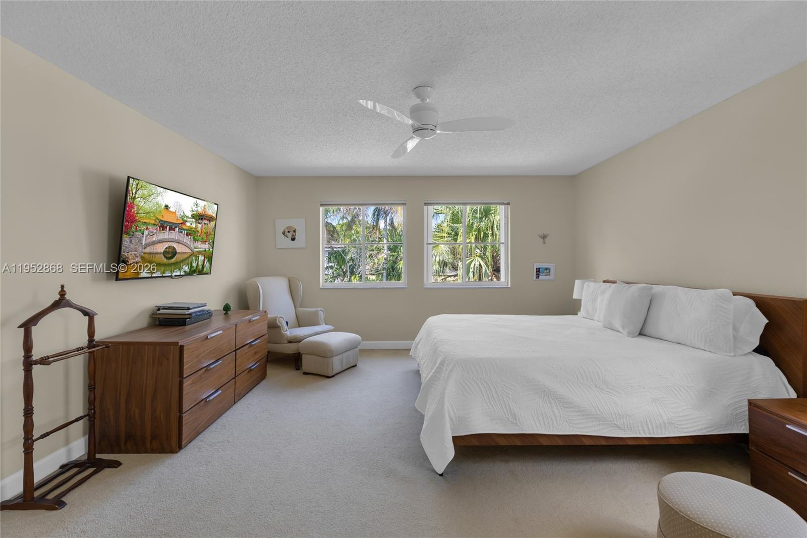 4441 Stone Ridge Way Weston, FL 33331 - Photo 38 of 87 a bedroom with a bed and glass windows