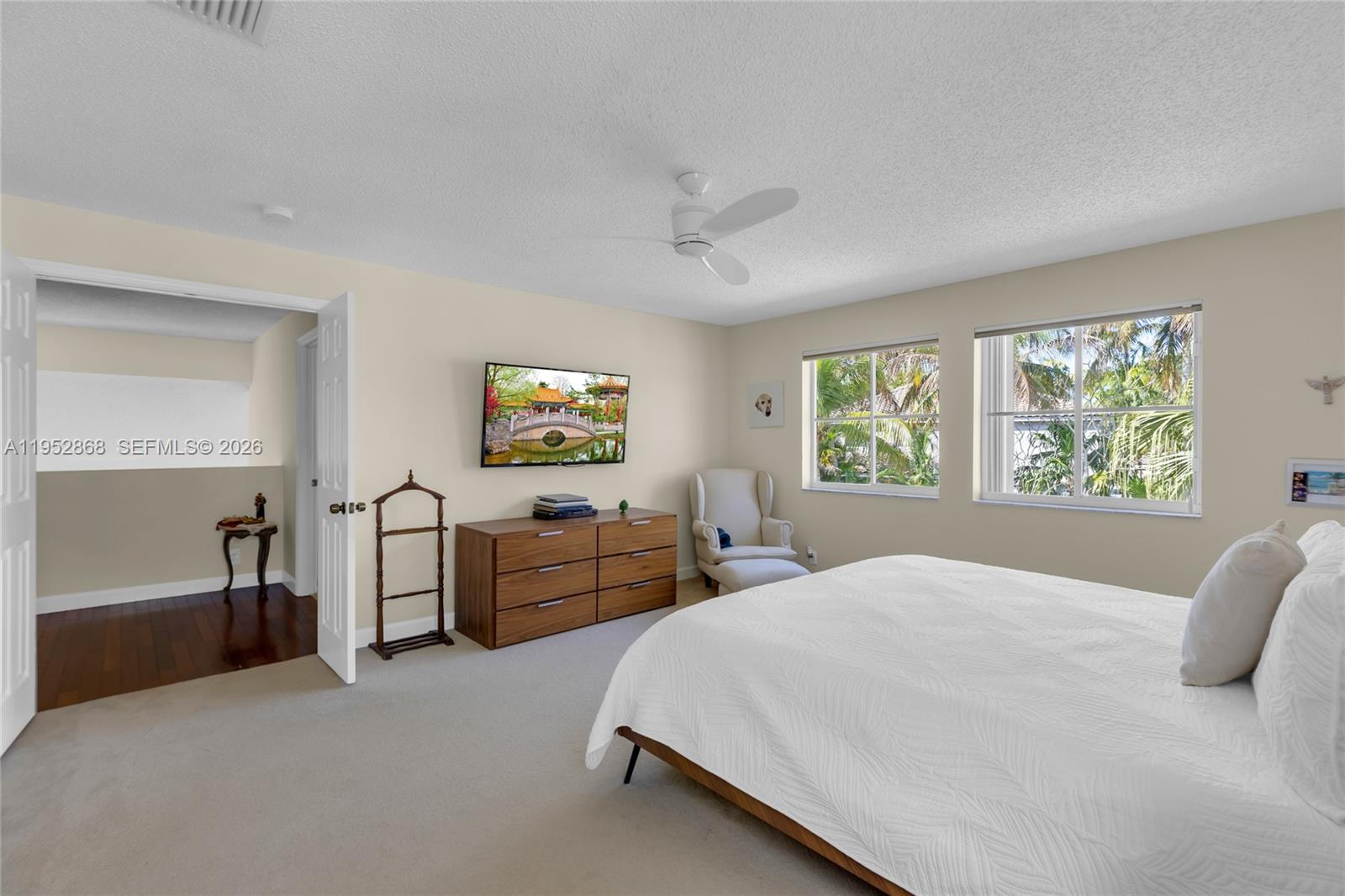 4441 Stone Ridge Way Weston, FL 33331 - Photo 39 of 87 a bedroom with a large bed and a window