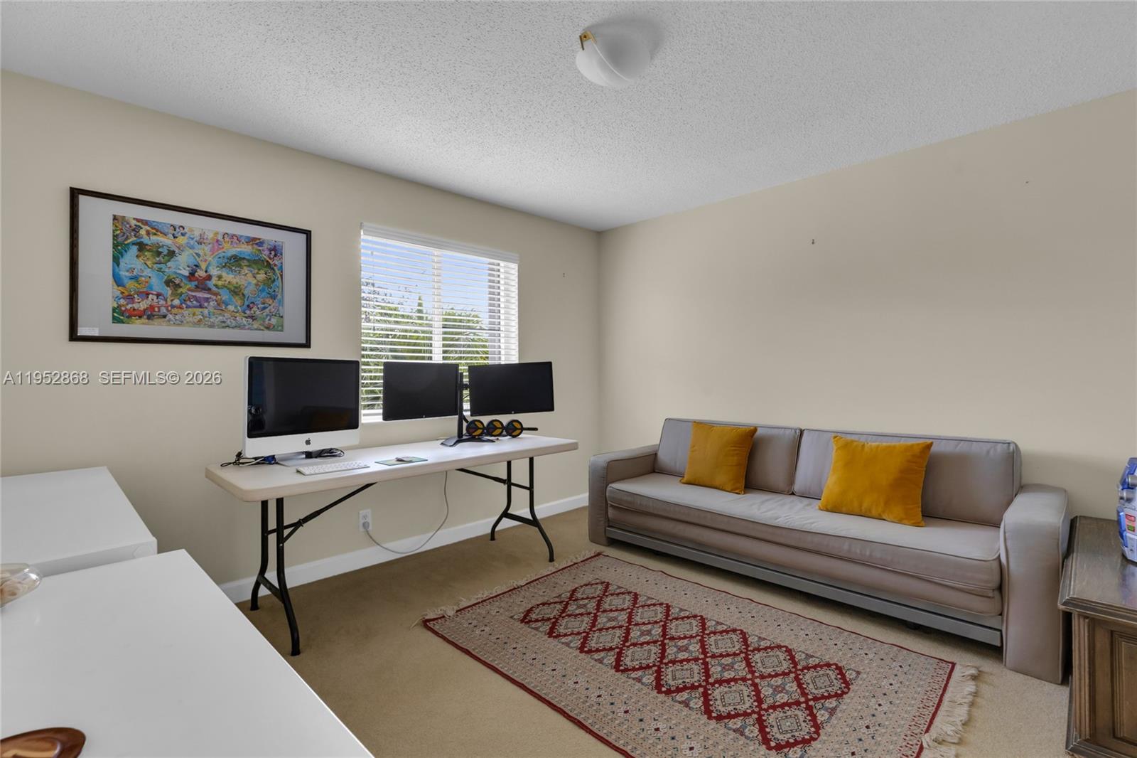 4441 Stone Ridge Way Weston, FL 33331 - Photo 49 of 87 a living room with furniture and a flat screen tv