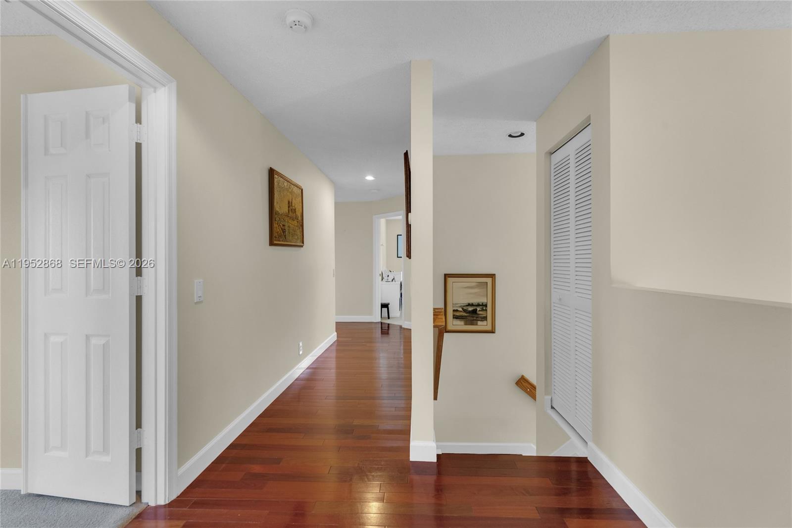 4441 Stone Ridge Way Weston, FL 33331 - Photo 52 of 87 a view of a hallway with wooden floor