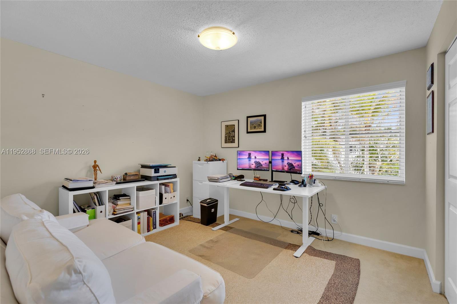 4441 Stone Ridge Way Weston, FL 33331 - Photo 54 of 87 a view of a workspace with furniture and a window