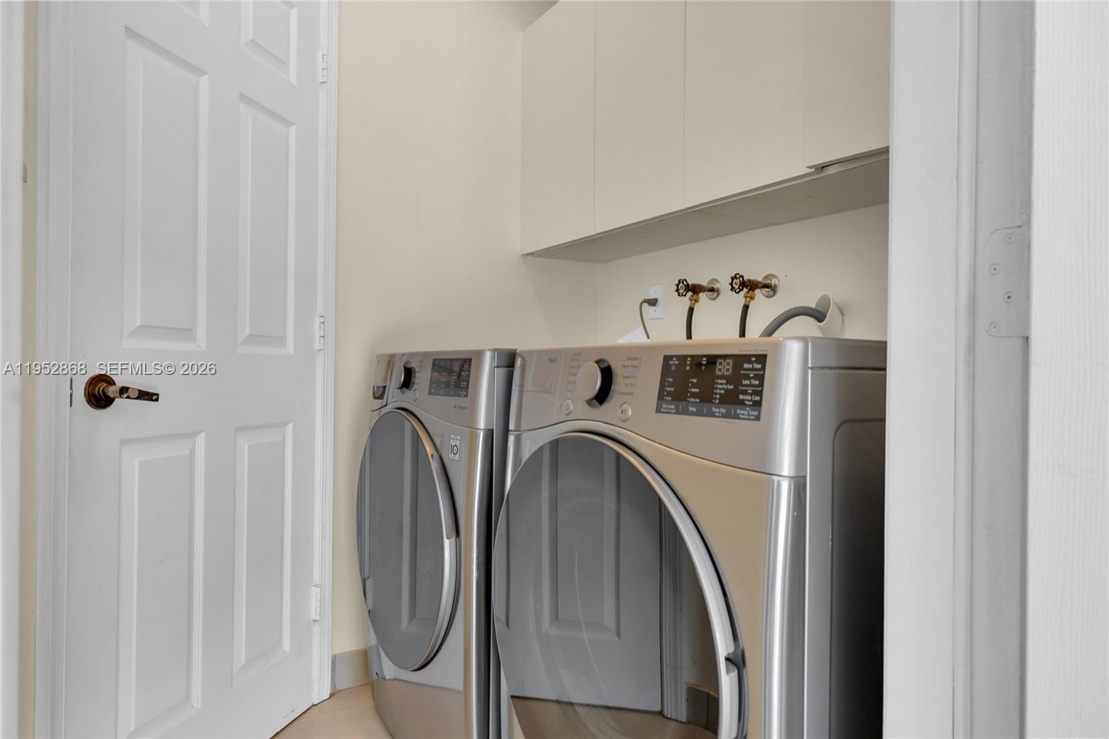 4441 Stone Ridge Way Weston, FL 33331 - Photo 55 of 87 a utility room with dryer and washer