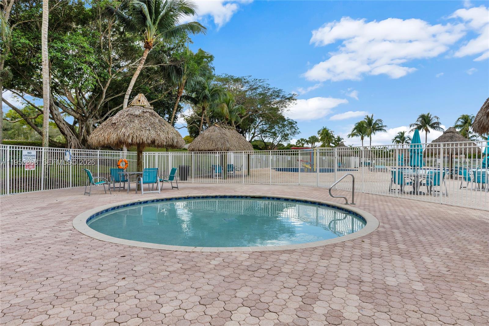 4441 Stone Ridge Way Weston, FL 33331 - Photo 62 of 87 a view of outdoor space yard swimming pool and outdoor seating