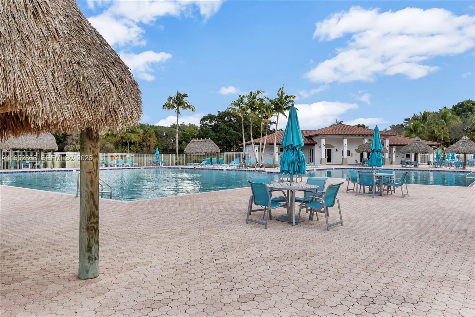 4441 Stone Ridge Way Weston, FL 33331 - Photo 63 of 87 a view of a patio with a table and chairs