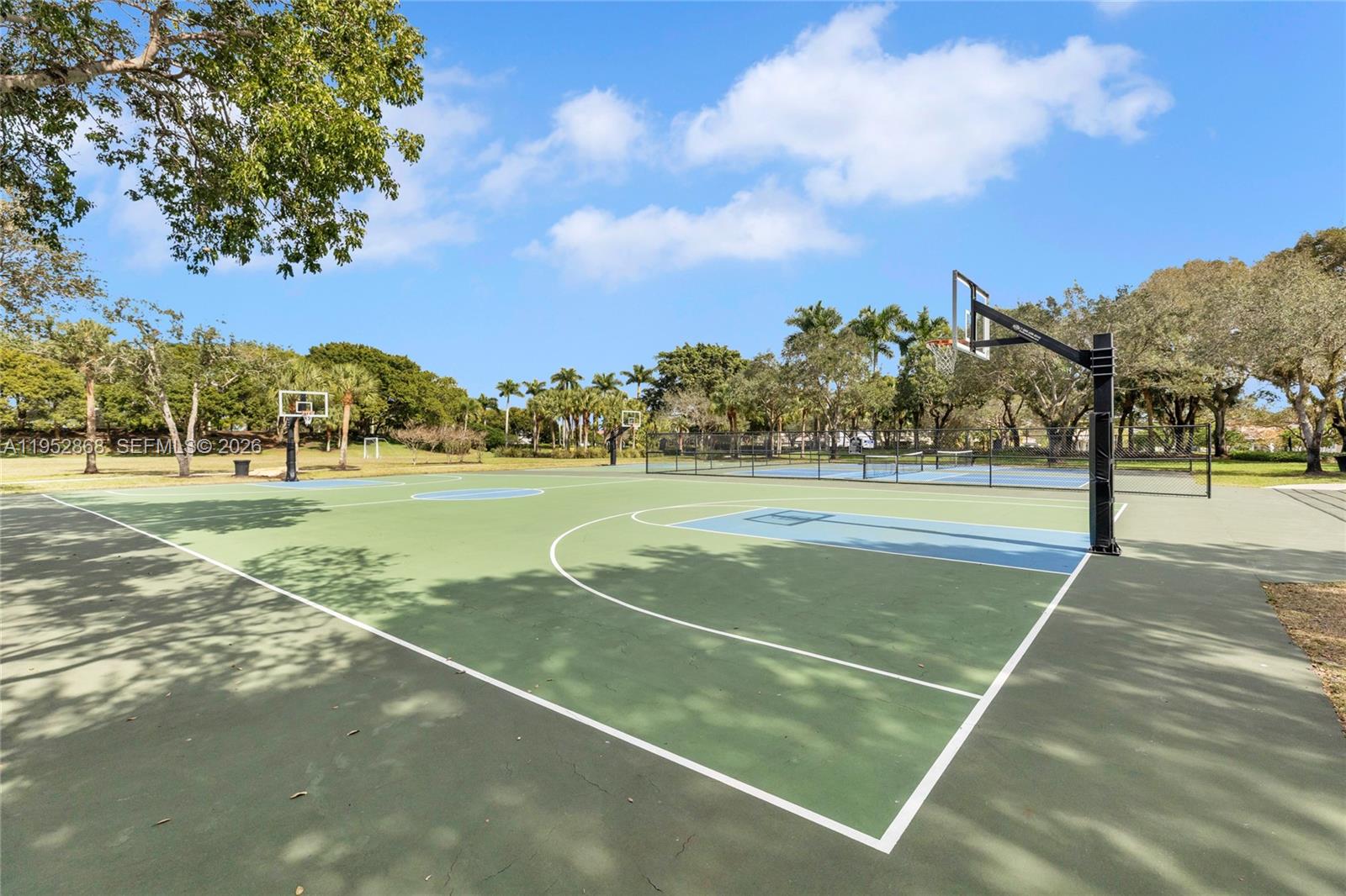 4441 Stone Ridge Way Weston, FL 33331 - Photo 65 of 87 a view of a tennis court