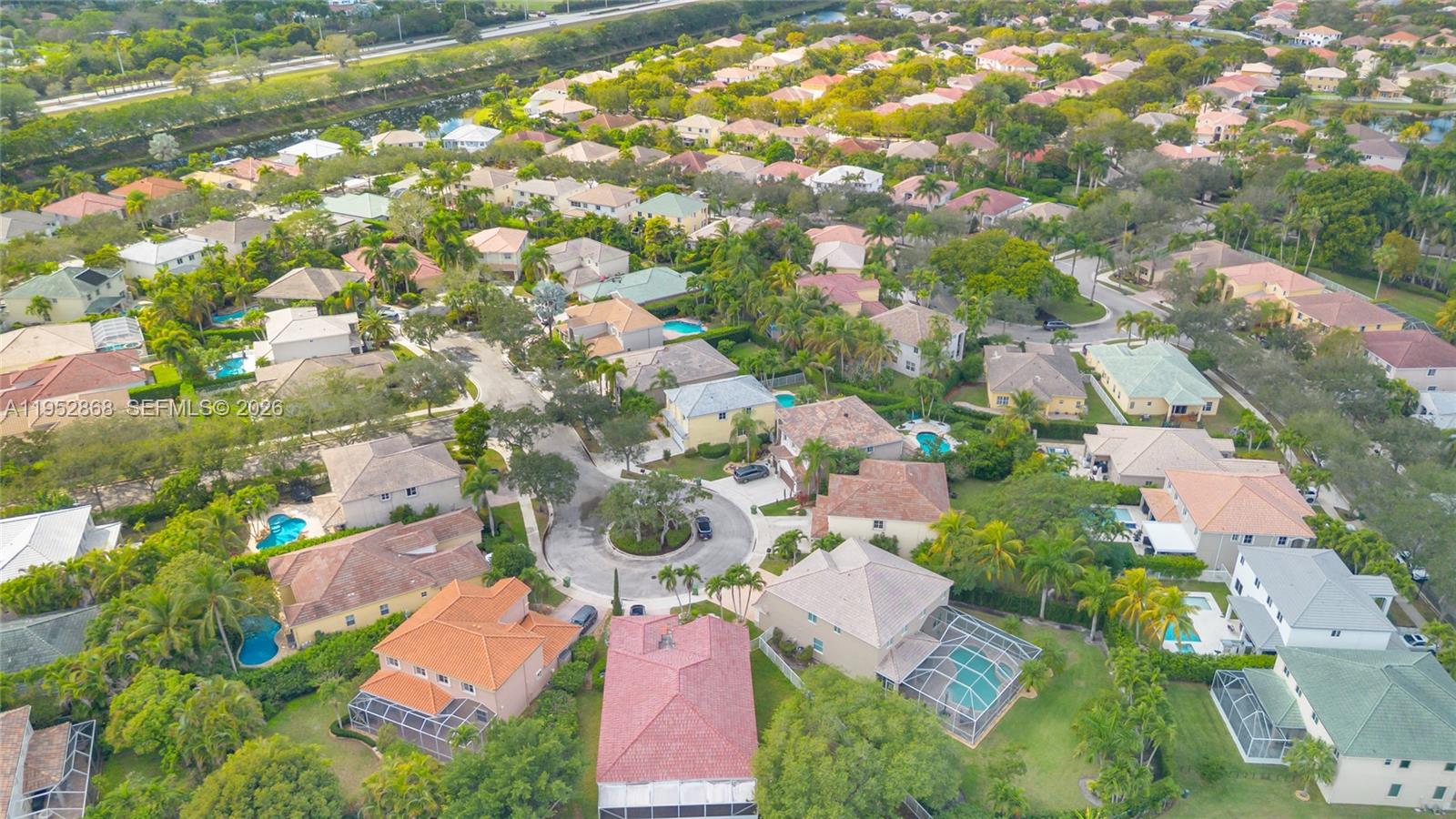 4441 Stone Ridge Way Weston, FL 33331 - Photo 81 of 87 an aerial view of residential houses with yard