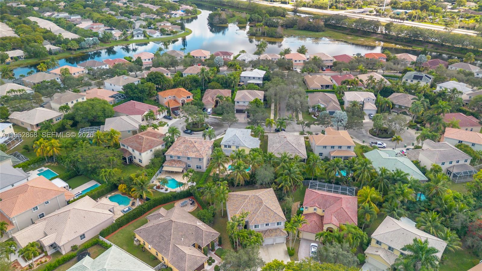 4441 Stone Ridge Way Weston, FL 33331 - Photo 84 of 87 an aerial view of residential houses with outdoor space and swimming pool