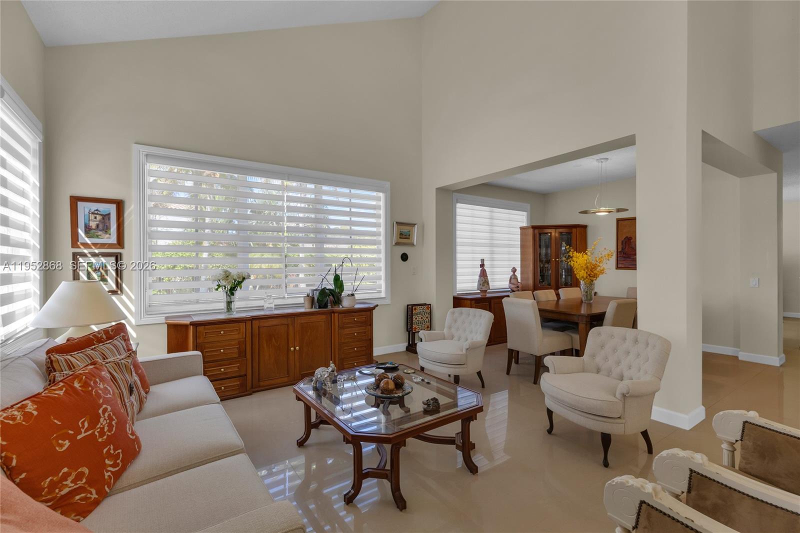 4441 Stone Ridge Way Weston, FL 33331 - Photo 9 of 87 a living room with furniture and a large window