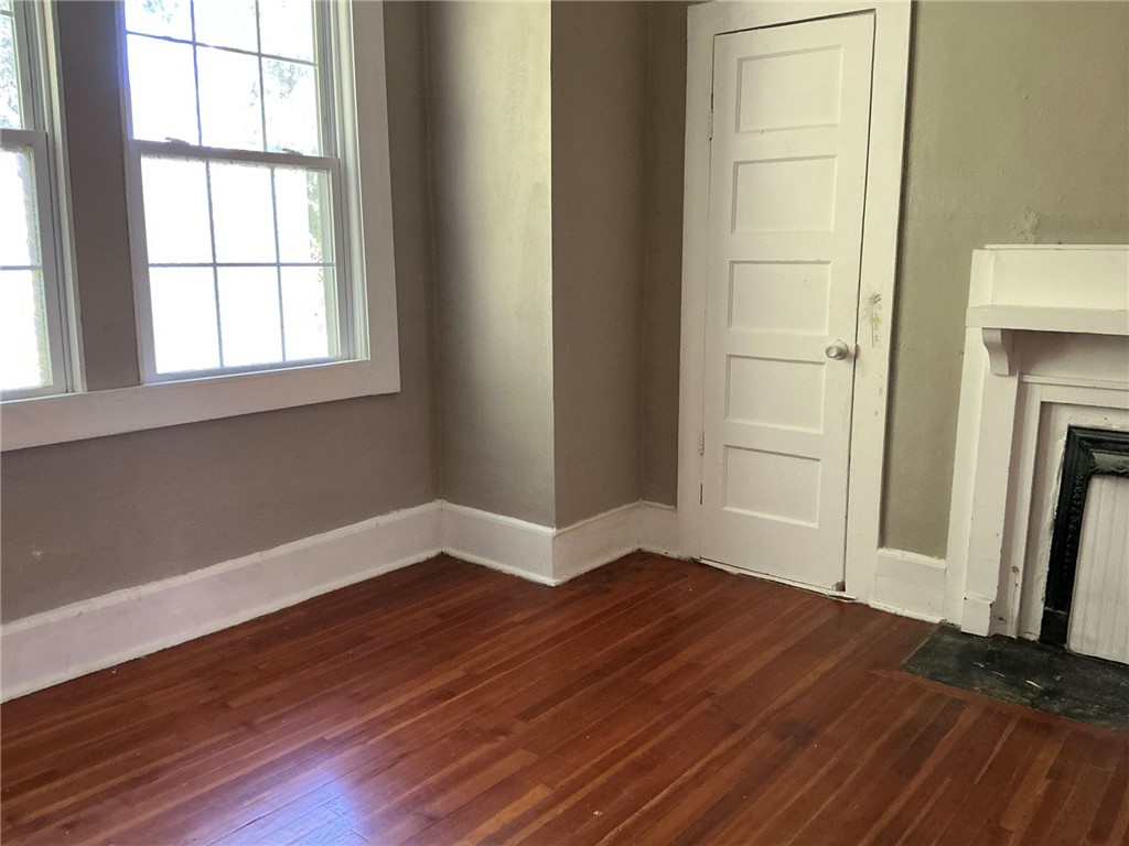 14 Ames Street Seneca, SC 29678 - Photo 7 of 15 This inviting space features lustrous wood floors and natural light from expansive windows.