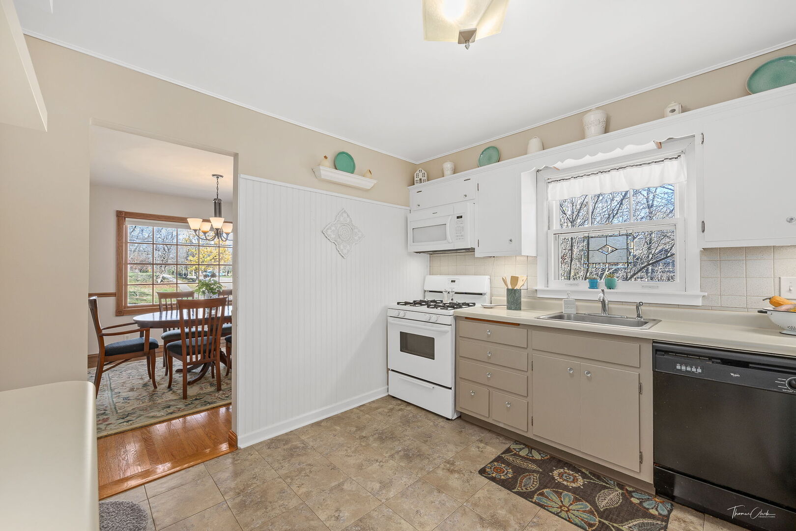 1901 Curtiss Street Downers Grove, IL 60515 - Photo 11 of 45 a kitchen with a stove a sink and a refrigerator