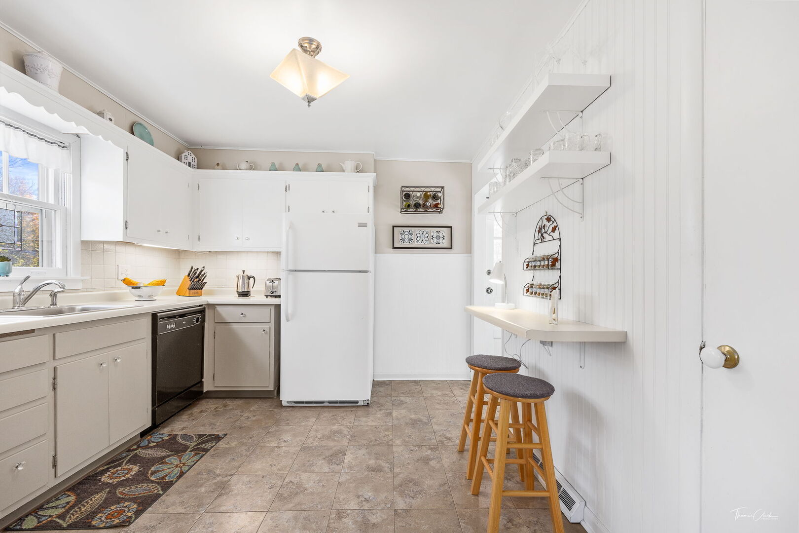 1901 Curtiss Street Downers Grove, IL 60515 - Photo 13 of 45 a kitchen with a refrigerator and white cabinets