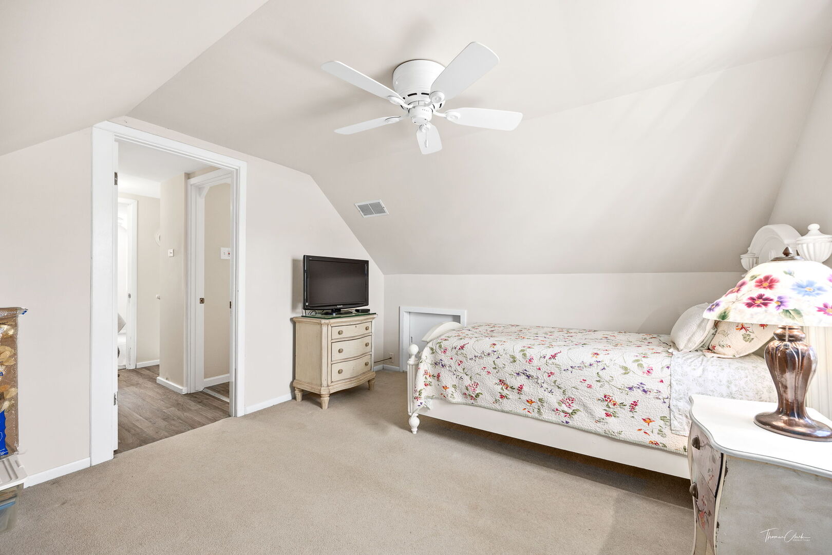 1901 Curtiss Street Downers Grove, IL 60515 - Photo 19 of 45 a bedroom with a bed and a flat screen tv