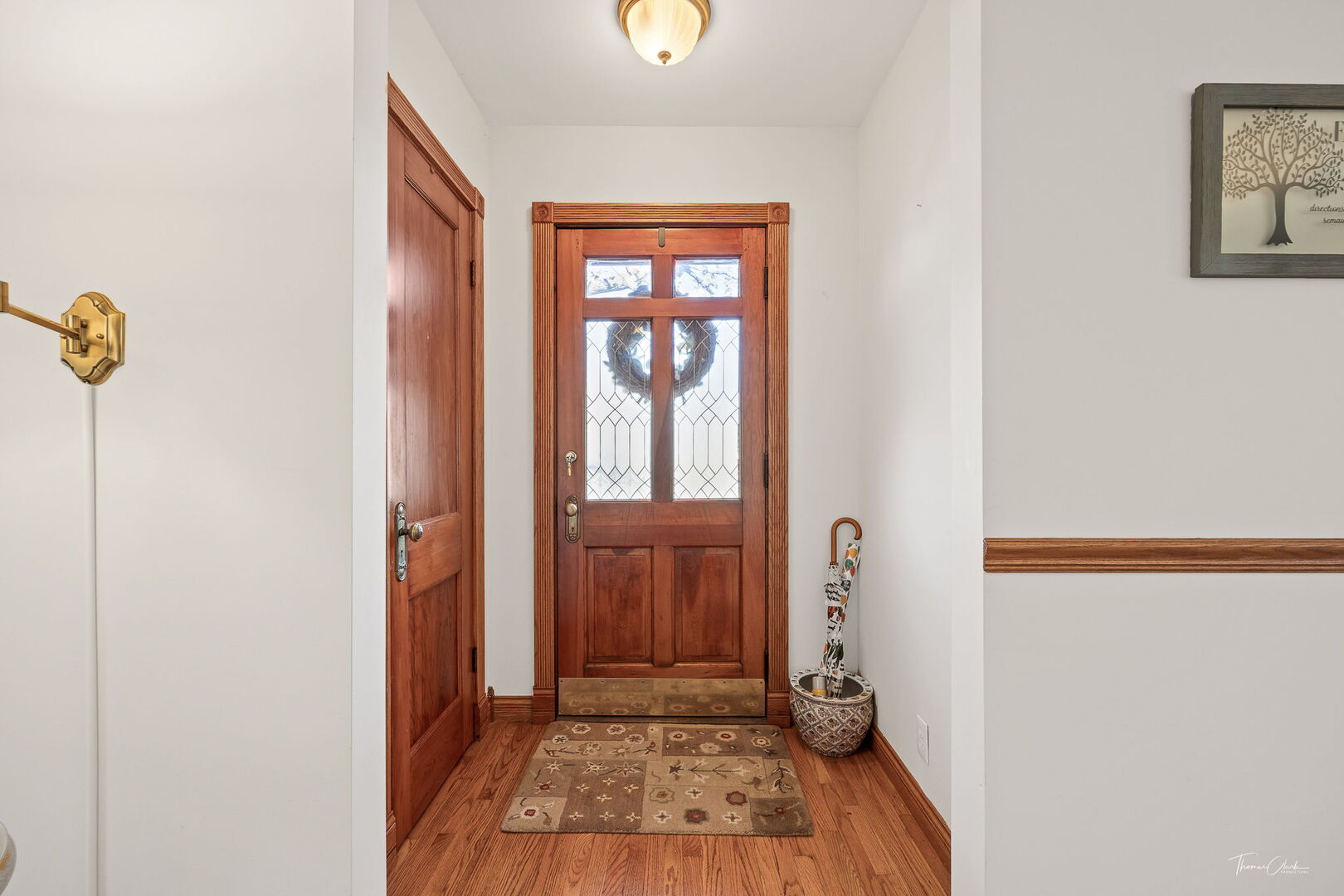 1901 Curtiss Street Downers Grove, IL 60515 - Photo 2 of 45 a view of an entryway with wooden floor