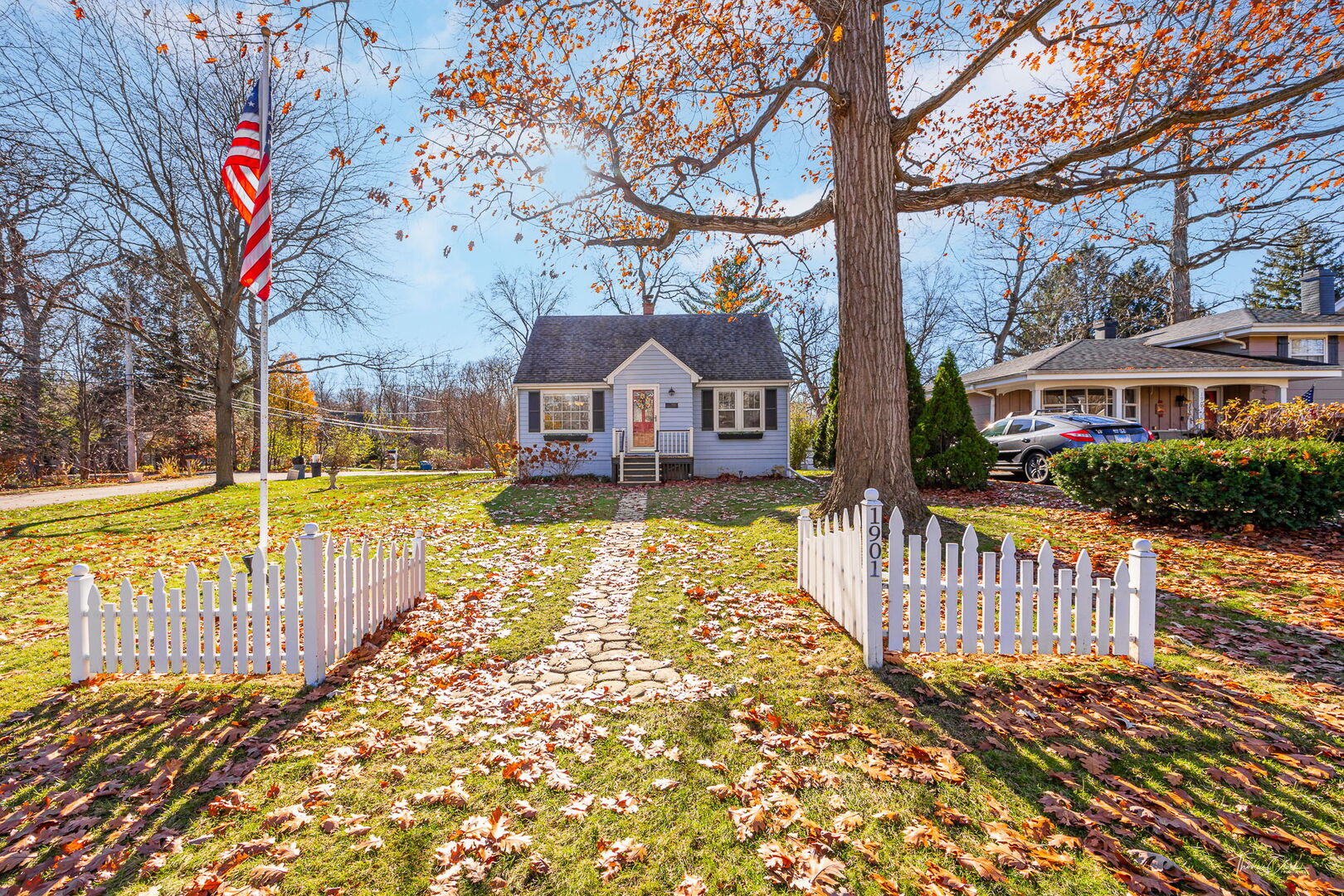 1901 Curtiss Street Downers Grove, IL 60515 - Photo 26 of 45 a view of a house with a wooden fence