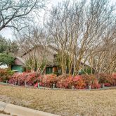 front view of a house with a tree