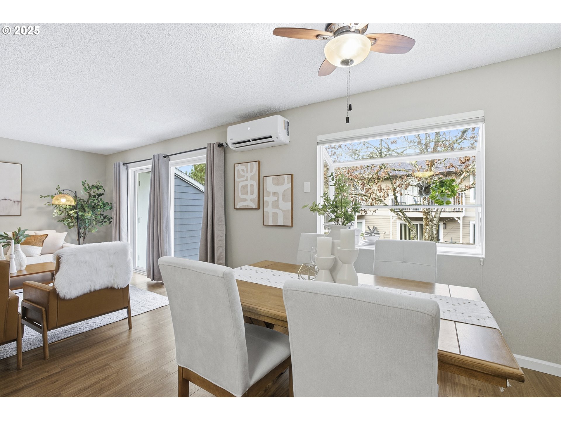 10955 Southwest Meadowbrook Drive, Unit 16 Portland, OR 97224 - Photo 12 of 26 a view of a dining room with furniture window and wooden floor
