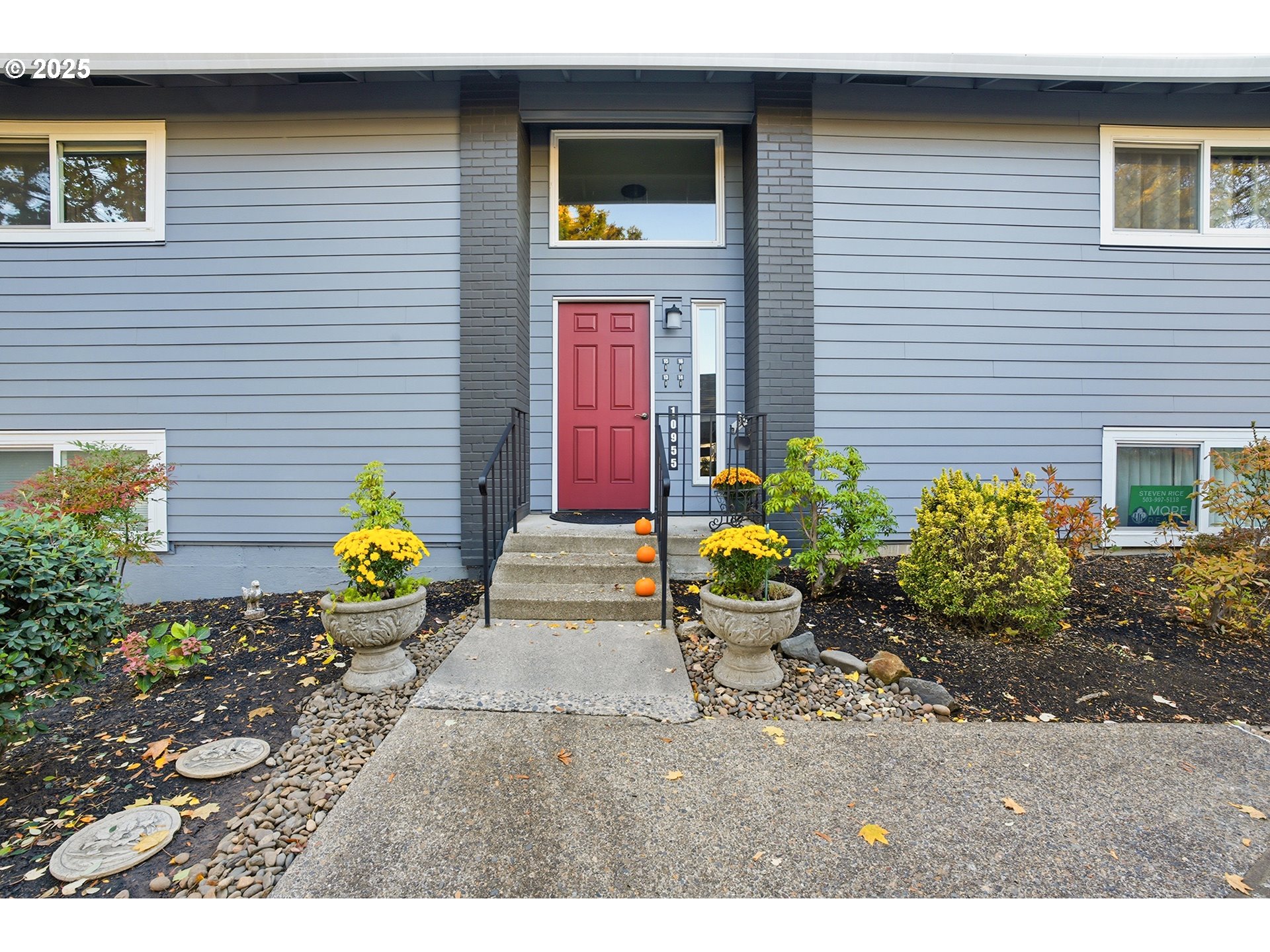 10955 Southwest Meadowbrook Drive, Unit 16 Portland, OR 97224 - Photo 2 of 26 a view of a backyard with chairs and potted plants
