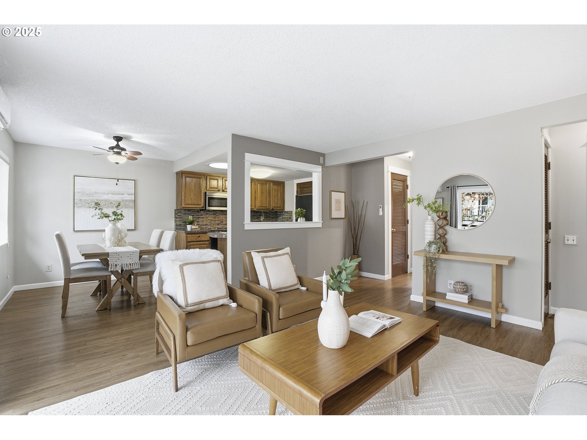 10955 Southwest Meadowbrook Drive, Unit 16 Portland, OR 97224 - Photo 7 of 26 a living room with furniture and wooden floor