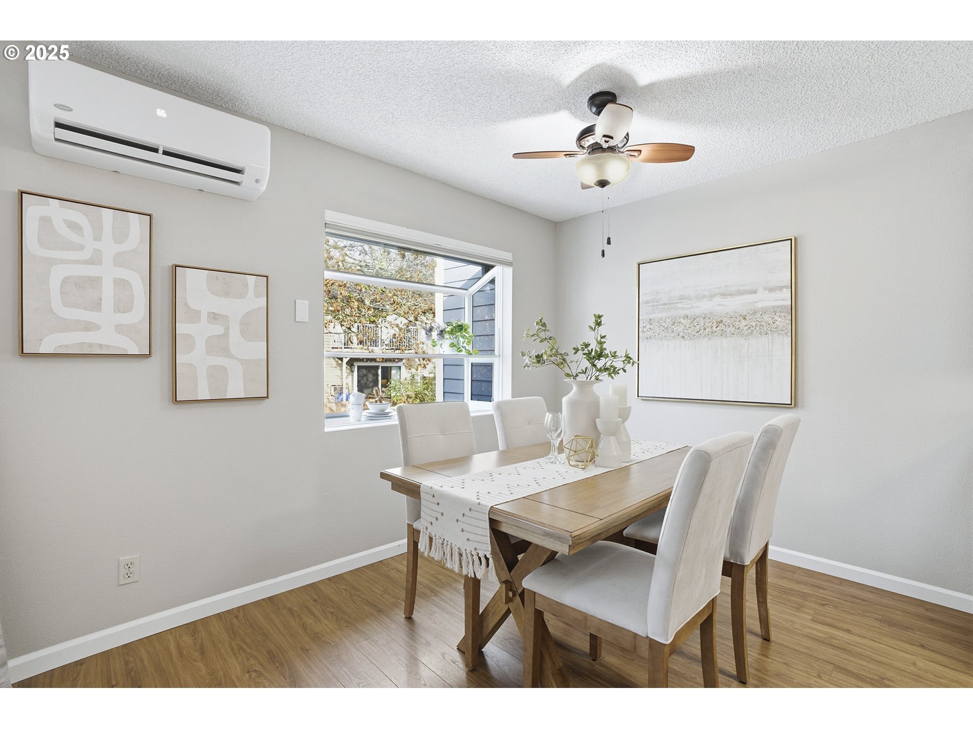 10955 Southwest Meadowbrook Drive, Unit 16 Portland, OR 97224 - Photo 10 of 26 a view of a dining room with furniture and chandelier