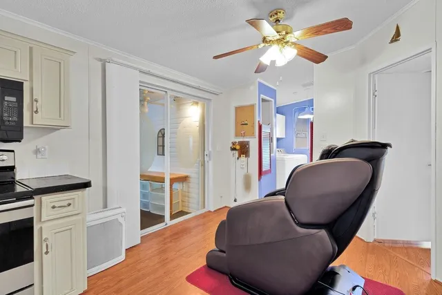 a bedroom with a large bed couch and a window