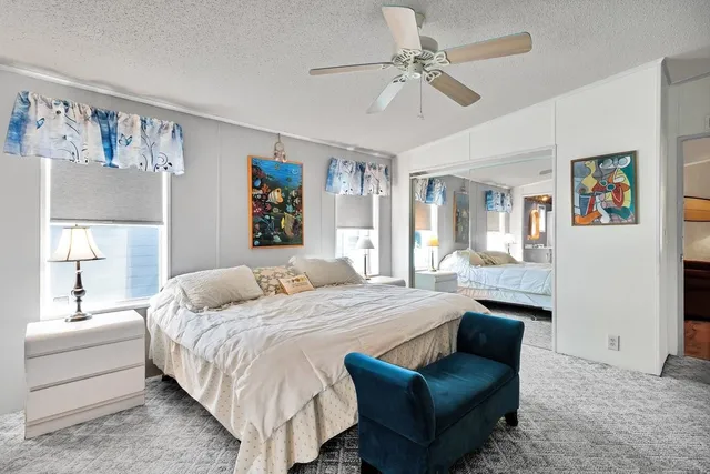 a bedroom with a bed and couch