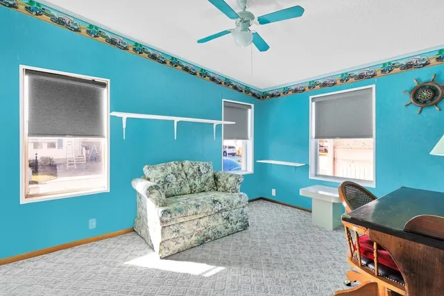 a room with furniture and fan