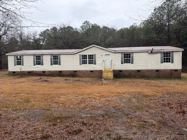 95 Eric Lane Autryville, NC 28318 - Photo 1 of 10 a house view with a garden space