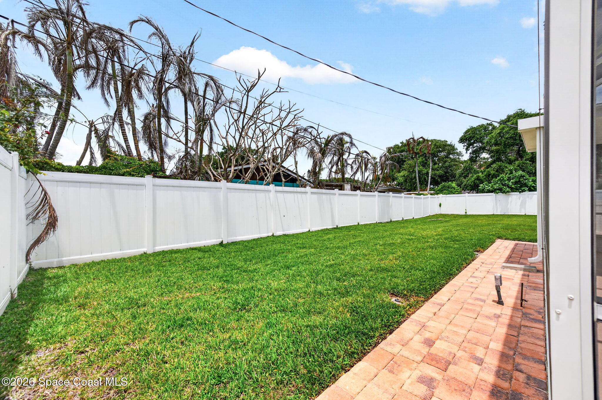 935 Samar Road Cocoa Beach, FL 32931 - Photo 21 of 22 a view of yard with green space
