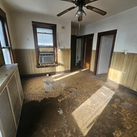 a view of an empty room with a fireplace