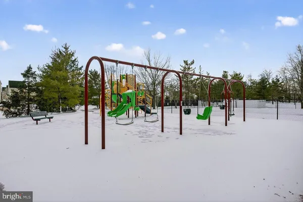 a bedroom with a bed and a mirror