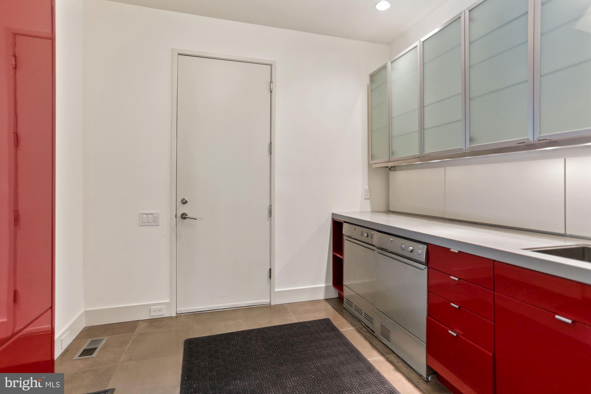 4716 Falstone Avenue Chevy Chase, MD 20815 - Photo 12 of 38 Mudroom and 2-car Garage access off Kitchen
